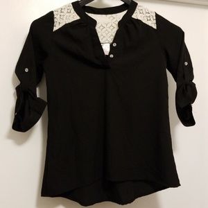 Black blouse with lace. Button up sleeves